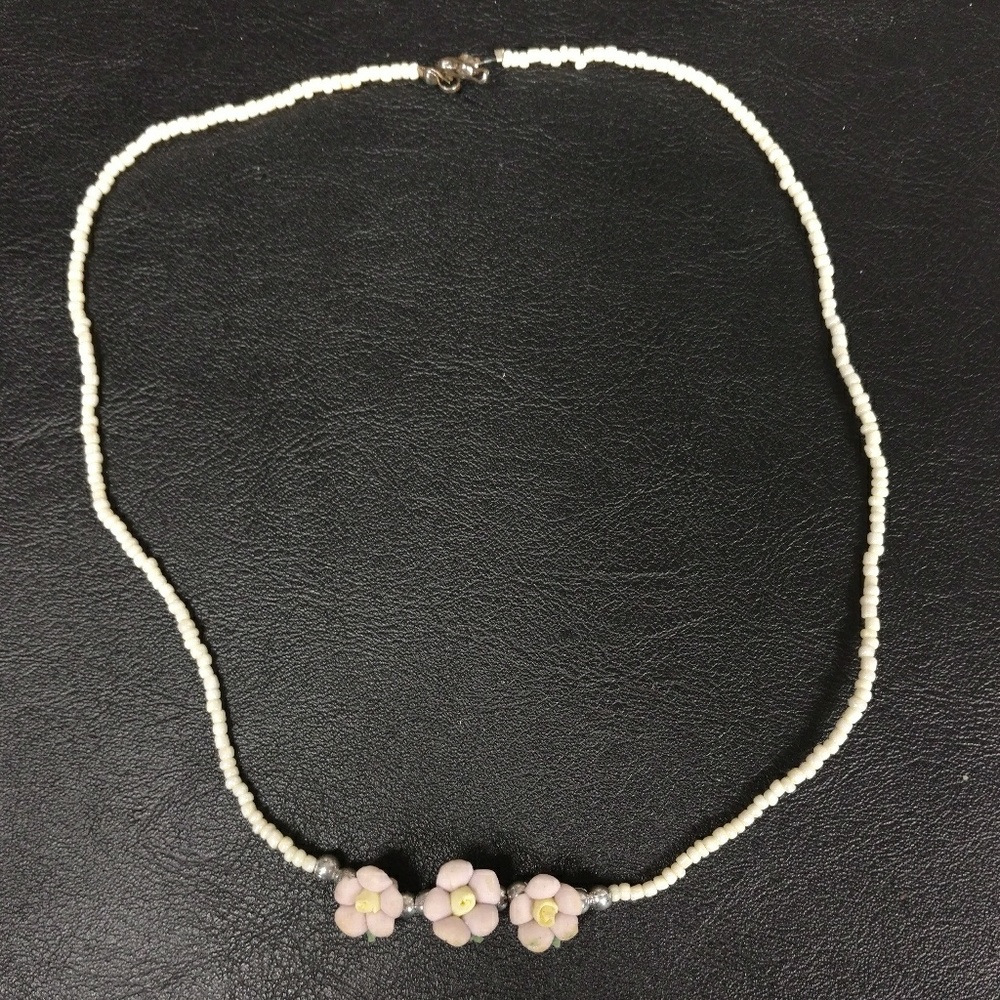 Feminine necklace with lavender porcelain flowers